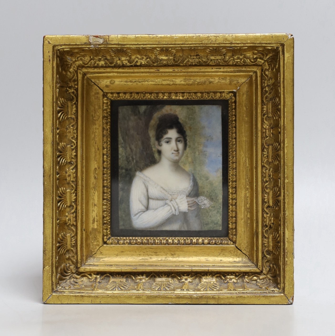 19th century English School, watercolour on ivory, Miniature of a lady holding a letter, 7 x 5.75cm